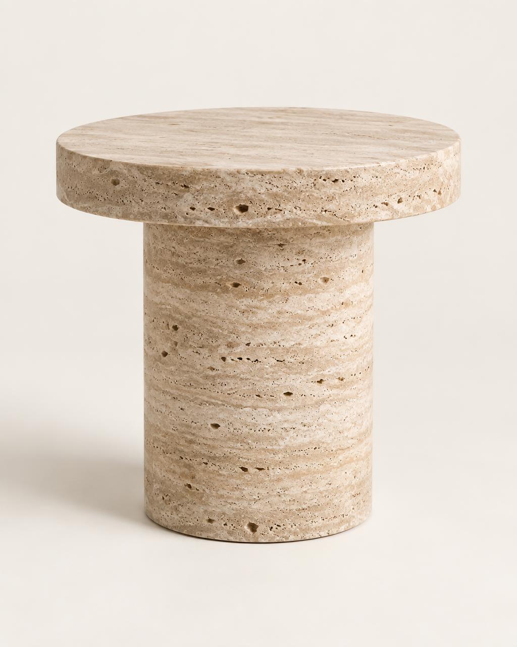 Pella cylindrical side table carved from travertine stone