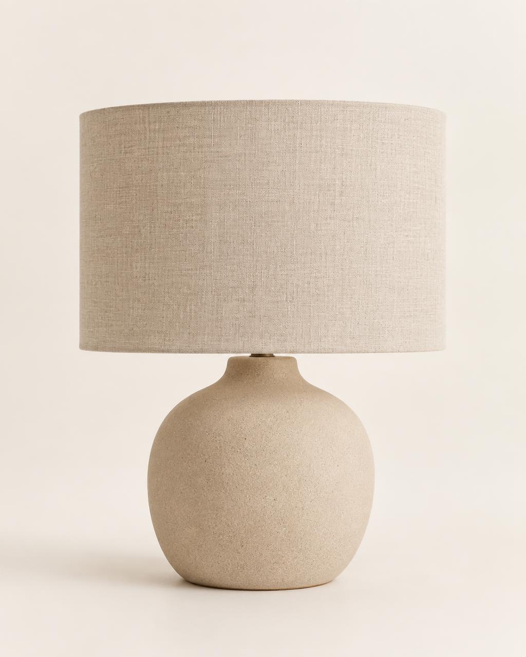 Sable table lamp with a matte ceramic base and linen drum shade